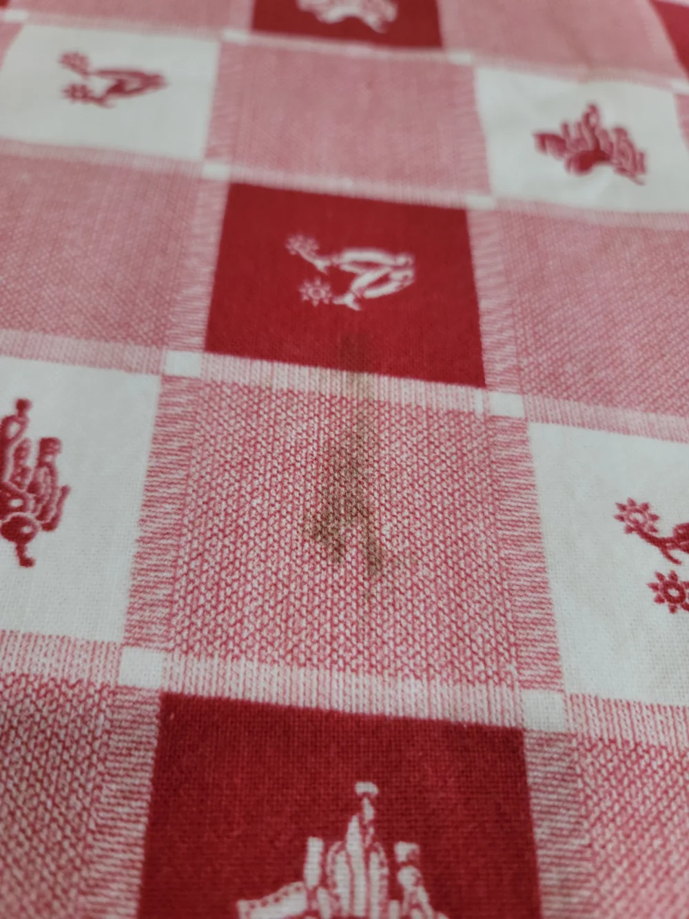 Vintage red and white checkered tablecloth small western-style horse saddle